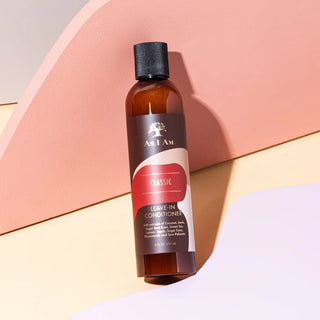 Brown bottle of leave-in conditioner with a black cap on a colorful background