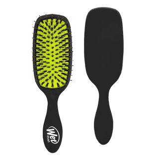 Black hairbrush with yellow bristle head on a white background