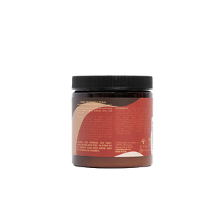 Jar of hair product with a black lid on a white background