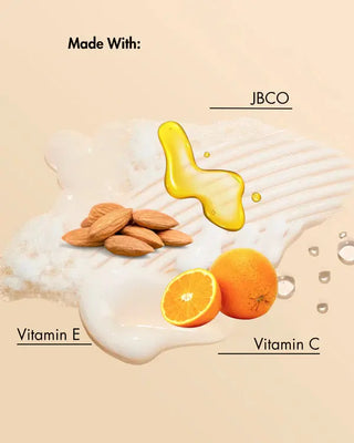 Product ingredients including almonds, oranges, and a yellow liquid labeled 'JBCO' on a beige background.