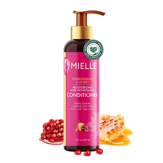 Mielle Pomegranate & Honey conditioner bottle with pomegranate and honey graphics on a white background