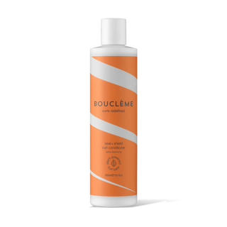 Boucleme hair care product bottle with orange and white design on a white background
