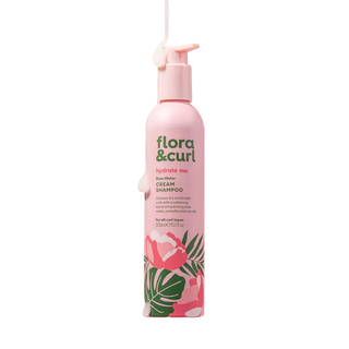 Flora & Curl shampoo bottle with floral design on a white background