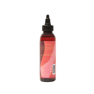 Bottle of As I Am hair oil with a red label on a white background