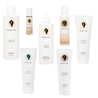 Collection of Bounce Curl hair care products on a white background