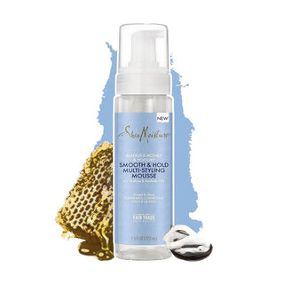 SheaMoisture hair mousse bottle with honeycomb and honey on a white background