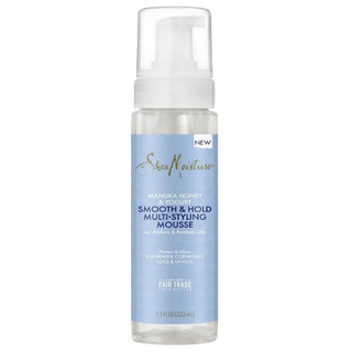 SheaMoisture hair mousse bottle with blue label on a white background