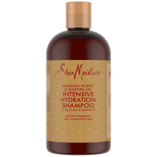 SheaMoisture shampoo bottle with gold cap on a white background