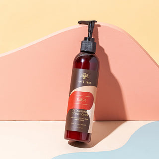 As I Am conditioner bottle on a colorful geometric background