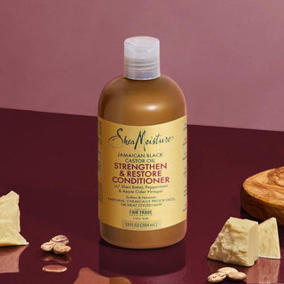 SheaMoisture Jamaican Black Castor Oil product on a purple background