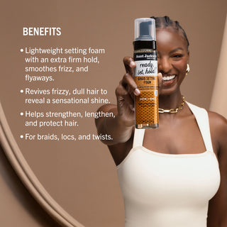 Woman holding a bottle of hair product with text detailing its benefits on a brown background