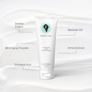 Bottle of 'Bounce Curl' conditioner with labeled ingredients on a white background