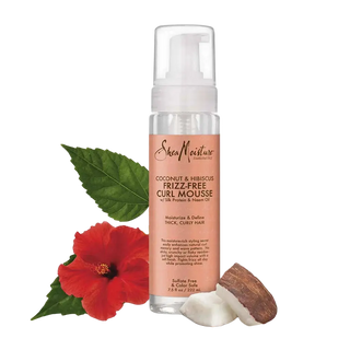 SheaMoisture coconut and hibiscus frizz-free curl mousse bottle with a red hibiscus flower and leaf on a white background