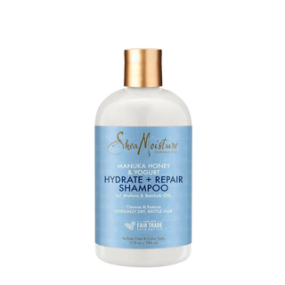 SheaMoisture shampoo bottle with blue label on a white background