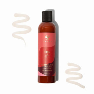 Bottle of 'Long & Luxe' hair product with a red label on a white background
