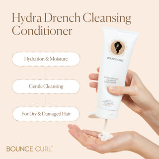 Bounce Curl Hydra Drench Cleansing Conditioner being dispensed onto a hand with product details on a beige background.
