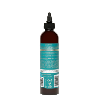 Bottle of shampoo with a label on a white background