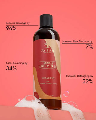 Shampoo bottle As I Am Jamaican Black Castor Oil Shampoo 355ml with red label on a pink background, showing product benefits.
