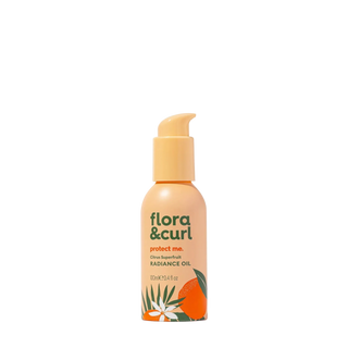 Flora & Curl radiance oil bottle on a white background