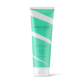 Green and white shampoo tube with 'Bouclème' branding on a white background