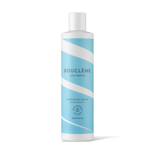 Boucleme hair cleanser bottle with blue and white design on a white background