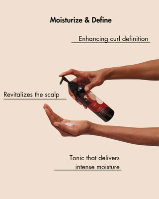 Person holding a bottle of hair tonic with text about moisturizing and defining curls on a beige background