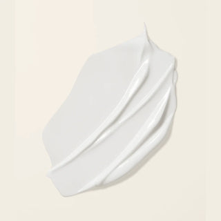 White Boucleme hair conditioner on a white background on a beige background