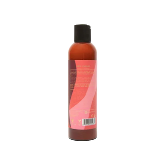 Bottle of 'Long & Luxe' hair product by As I Am on a white background
