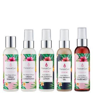 Set of Flora & Curl hair care products with colorful labels on a white background