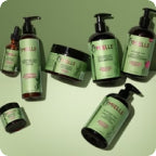 Set of green skincare products on a white background