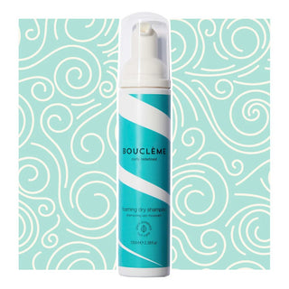Boucleme dry shampoo can on a light blue background with white patterns