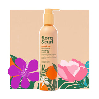 Flora & Curl shampoo bottle with floral packaging on a beige background