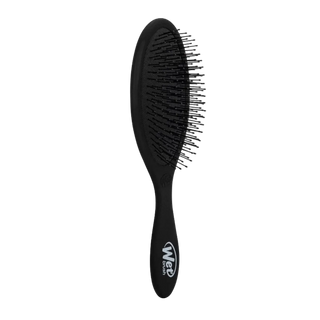 Black hairbrush with bristle head on a white background