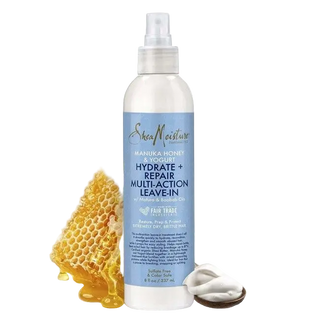 SheaMoisture hair care product with honeycomb and leaves on a white background